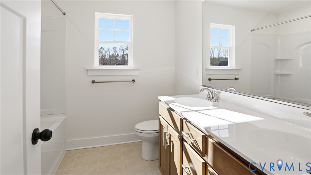 8900 Freebridge Road Chesterfield, VA 23832 - Photo 34 of 50 a bathroom with a sink a toilet and shower