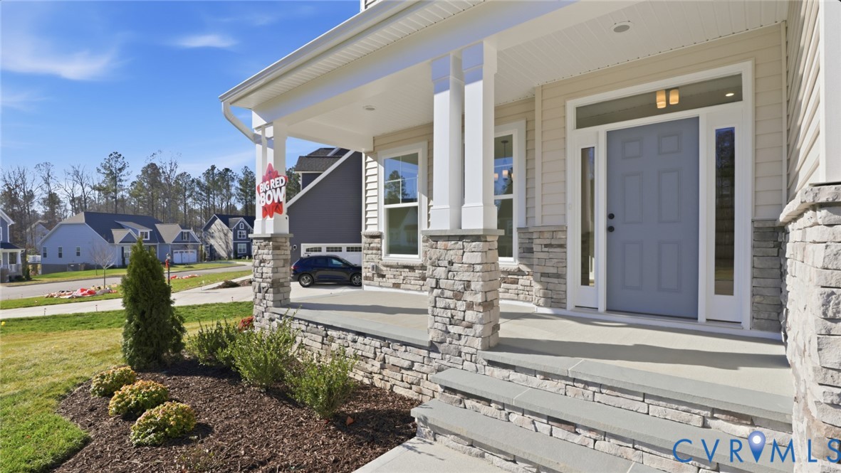 8900 Freebridge Road Chesterfield, VA 23832 - Photo 47 of 50 a front view of a house with a garden and swimming pool
