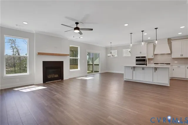 a view of kitchen with cabinets and wooden floor