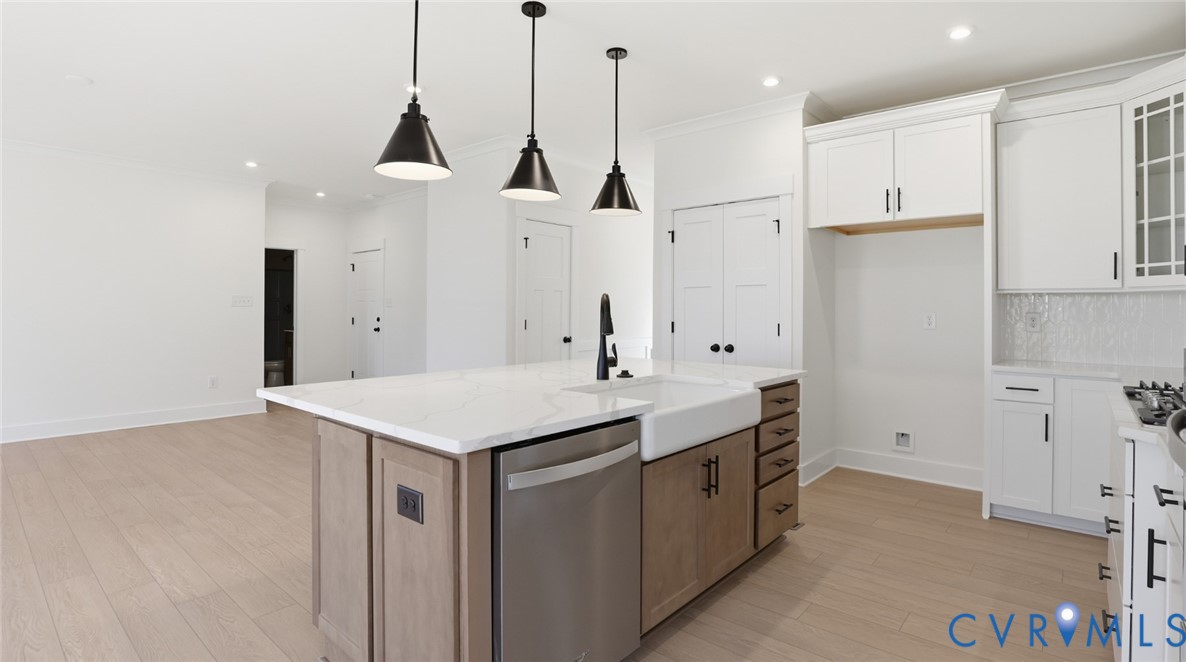 8900 Freebridge Road Chesterfield, VA 23832 - Photo 9 of 50 a kitchen with kitchen island a sink appliances and cabinets