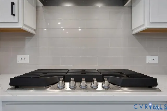a spacious bathroom with a granite countertop sink a mirror and shower