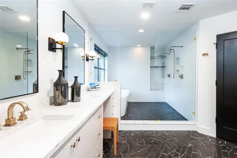 a kitchen with sink cabinets and stove