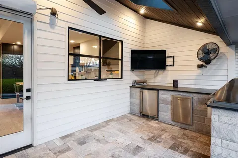 a view of a kitchen with a sink and a microwave