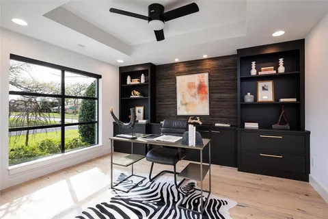 a work room with furniture and windows