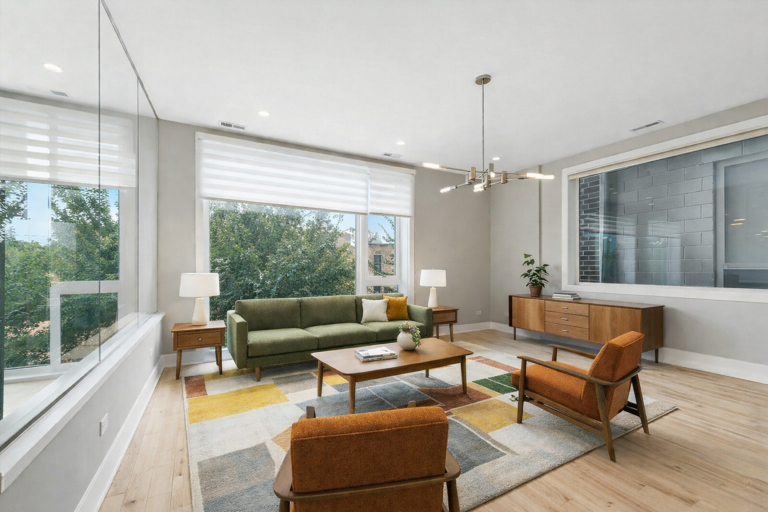 826 West Cullerton Street, Unit 2W Chicago, IL 60608 - Photo 11 of 23 a living room with furniture and a chandelier