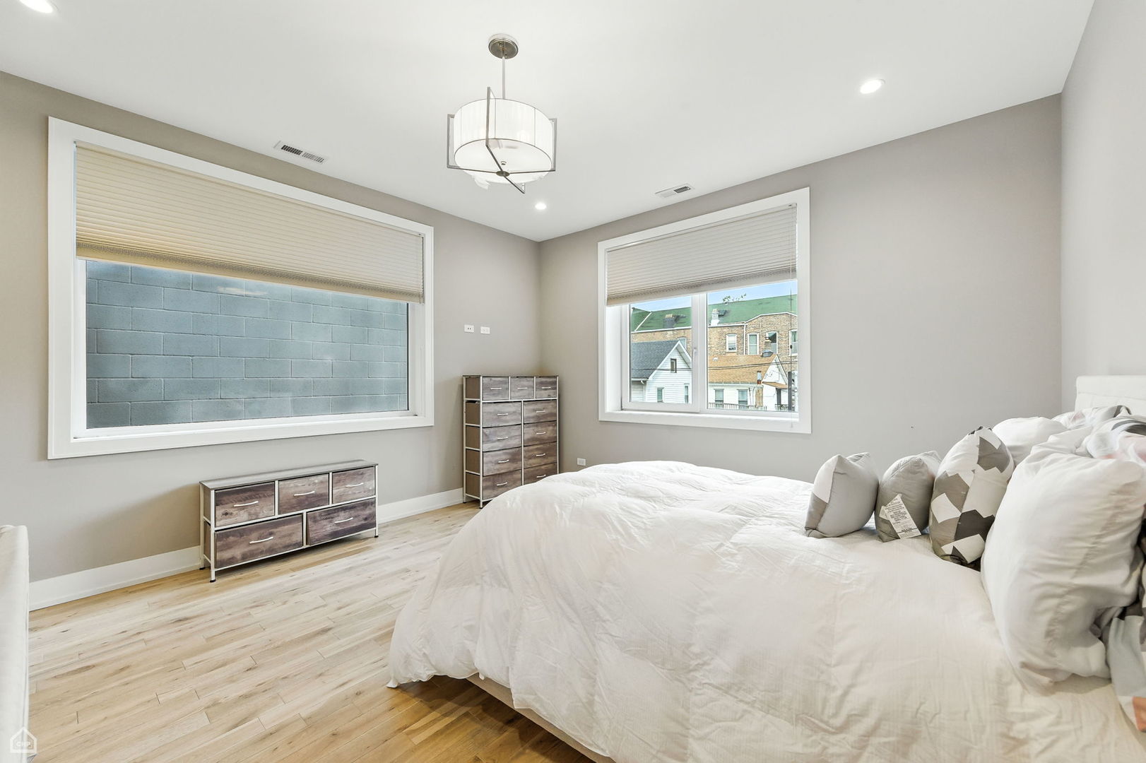 826 West Cullerton Street, Unit 2W Chicago, IL 60608 - Photo 14 of 23 a bedroom with a large bed and a window
