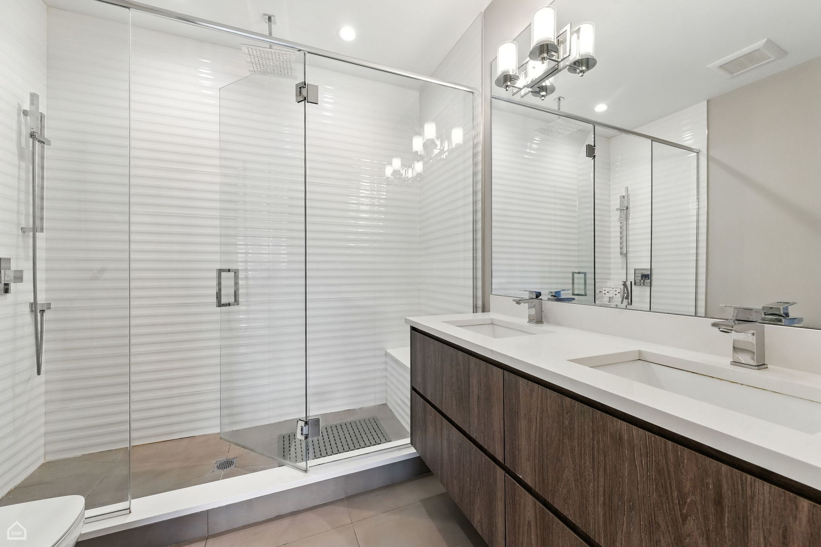 826 West Cullerton Street, Unit 2W Chicago, IL 60608 - Photo 16 of 23 a bathroom with a double vanity sink and mirror