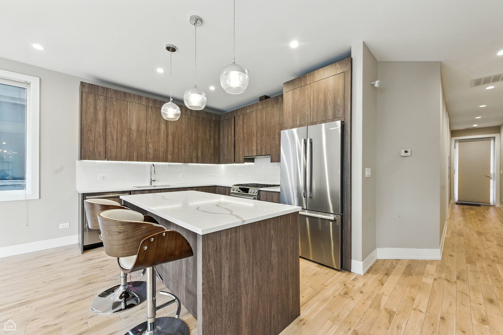 826 West Cullerton Street, Unit 2W Chicago, IL 60608 - Photo 4 of 23 a kitchen with a refrigerator a sink and a stove top oven