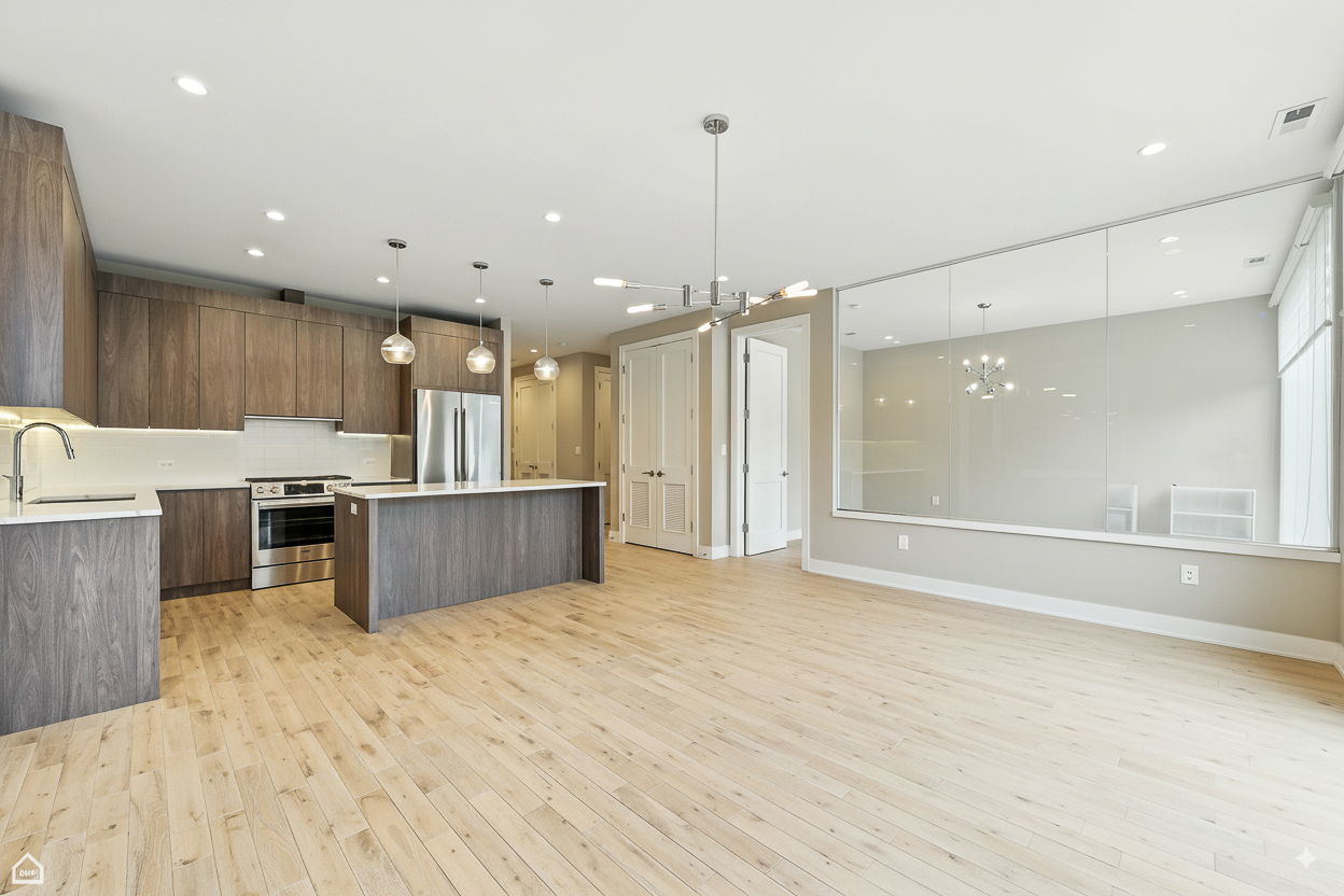 826 West Cullerton Street, Unit 2W Chicago, IL 60608 - Photo 9 of 23 a view of kitchen with kitchen island a sink stainless steel appliances and cabinets