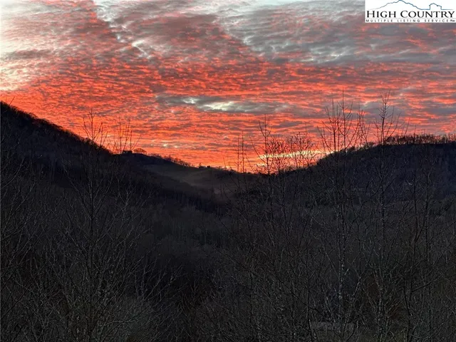 a bathroom with a toilet a sink and view