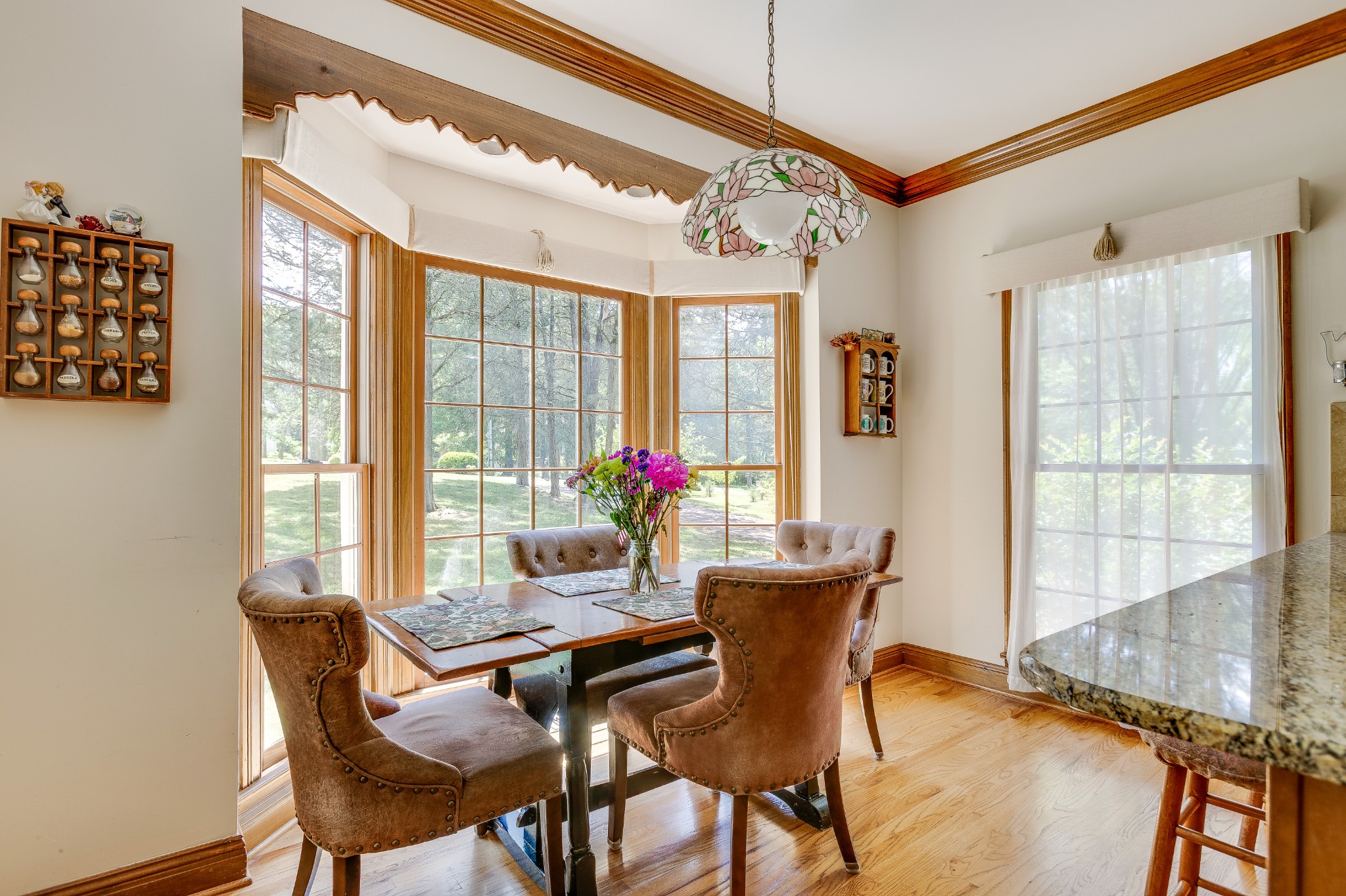 1111 Temple Ridge Court Nashville, TN 37221 - Photo 21 of 46 a view of a dining room with furniture wooden floor and a potted plant
