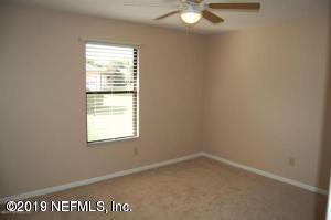 2939 Lakeside Villa Road, Unit B Orange Park, FL 32073 - Photo 7 of 8 an empty room with a window