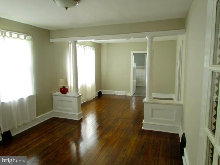 1755 Glassboro Road Sewell, NJ 08080 - Photo 4 of 28 a room with wooden floor and windows