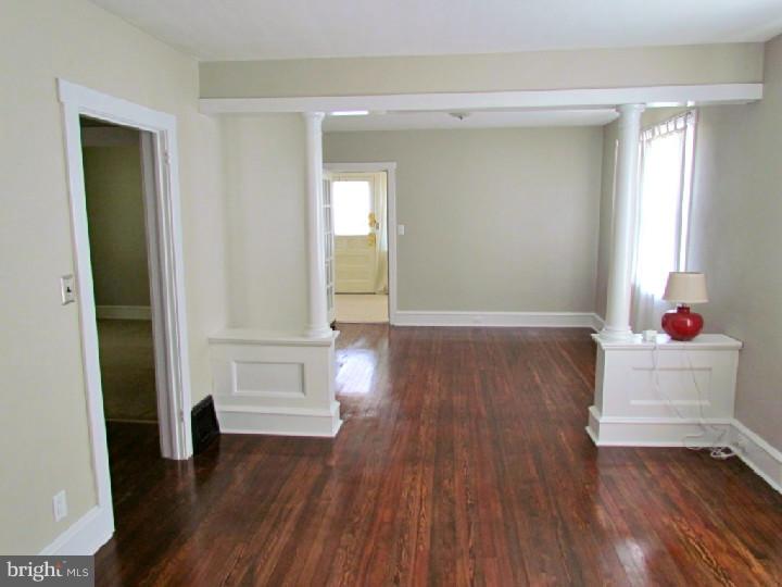 1755 Glassboro Road Sewell, NJ 08080 - Photo 6 of 28 wooden floor in an empty room and a mirror