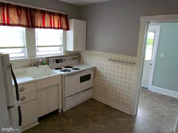a bathroom with a sink and a window