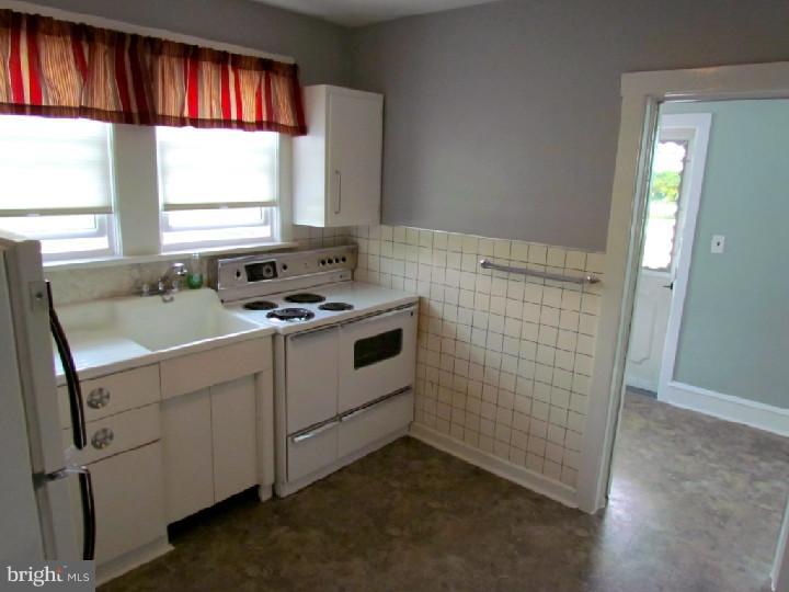 1755 Glassboro Road Sewell, NJ 08080 - Photo 9 of 28 a bathroom with a sink and a window