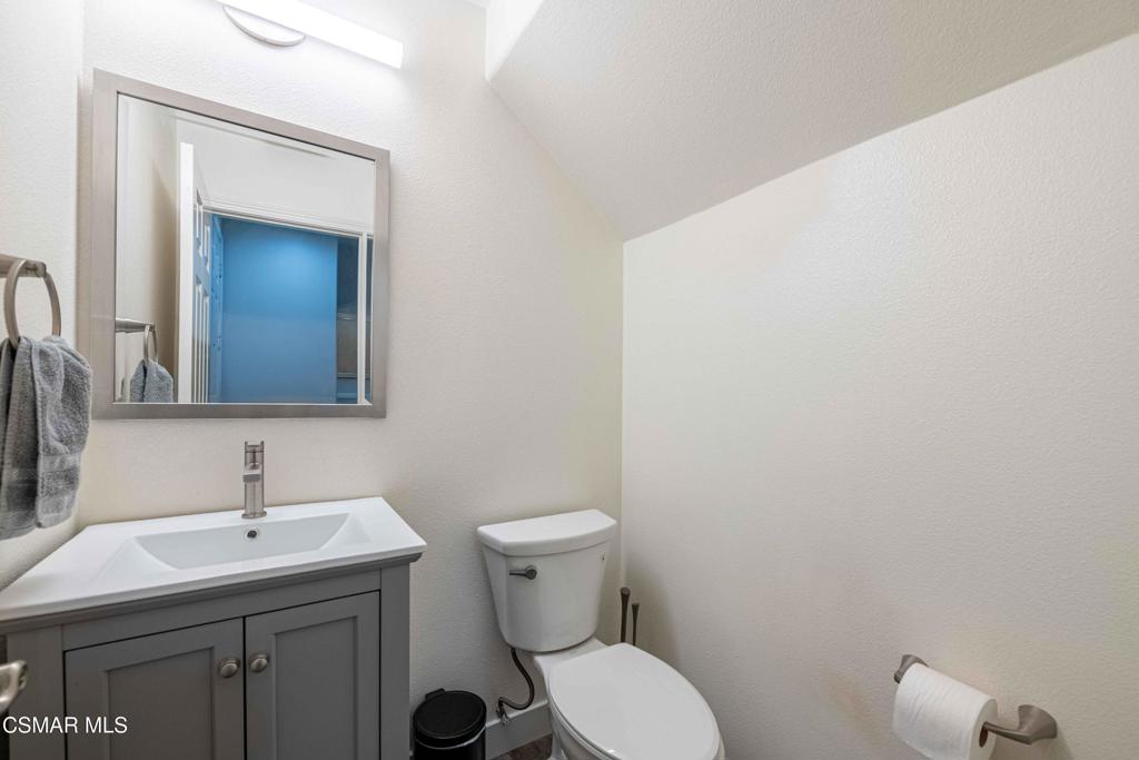 580 Fenwick Way, Unit C Simi Valley, CA 93065 - Photo 17 of 39 a bathroom with a toilet a sink and mirror
