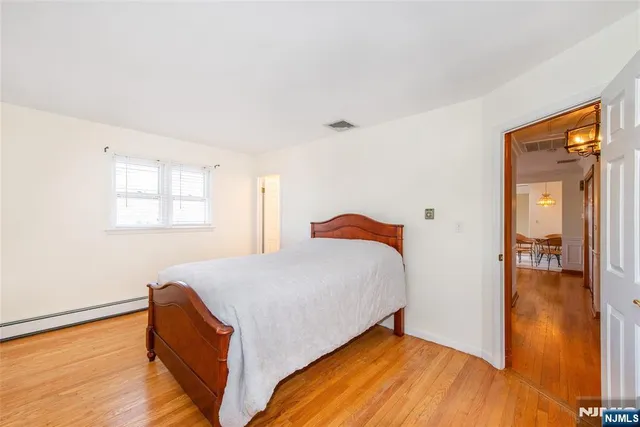 a bed room with a bed and a window