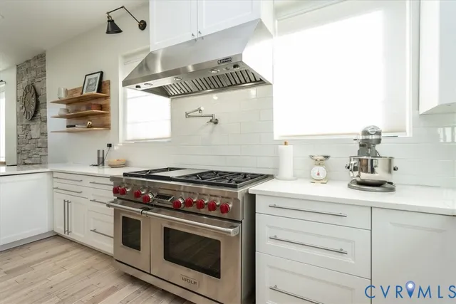 a kitchen with a stove and a sink