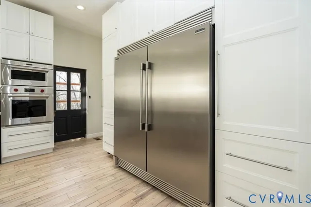 a en suite bathroom with a shower and a sink