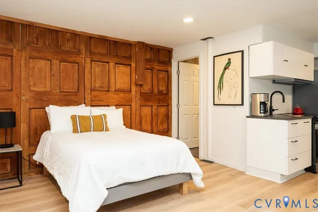 a kitchen with stainless steel appliances a stove refrigerator sink and cabinets