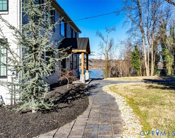 a view of a yard with trees in the background