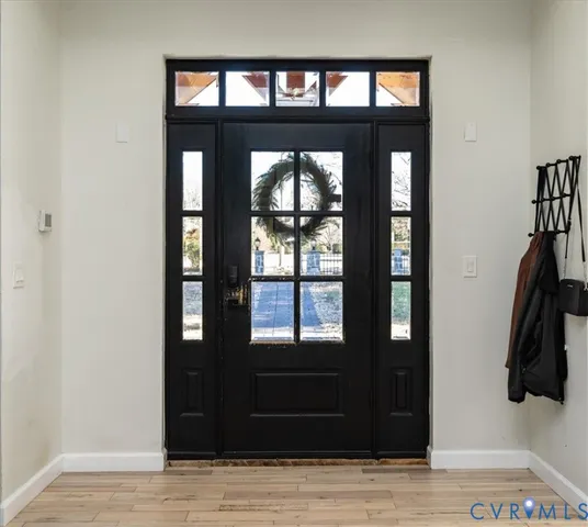 a view of a living room and front door
