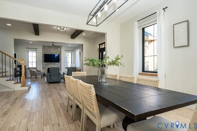 a living room with furniture fireplace and wooden floor