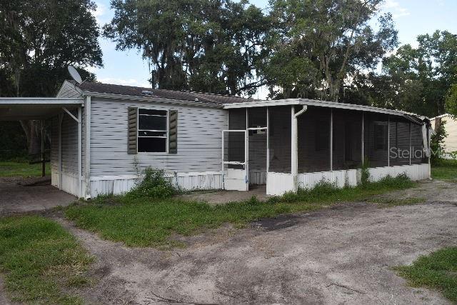 3223 J J Manor Road Lakeland, FL 33810 - Photo 1 of 1 a front view of a house with garden