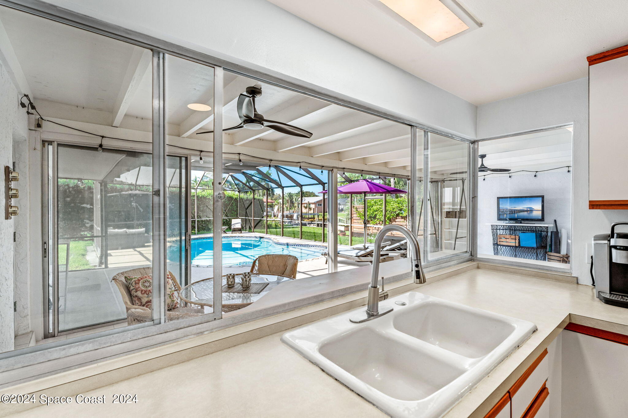 307 Brightwaters Drive Cocoa Beach, FL 32931 - Photo 12 of 45 Pass-through window and a view!