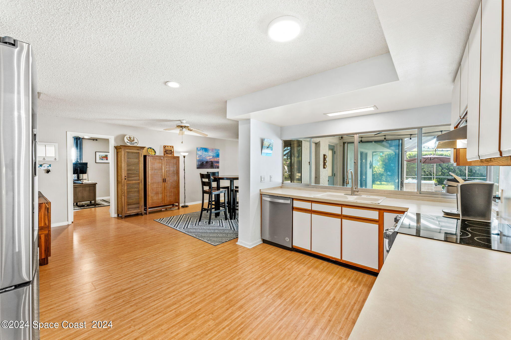 307 Brightwaters Drive Cocoa Beach, FL 32931 - Photo 14 of 45 Looking toward the casual dining area