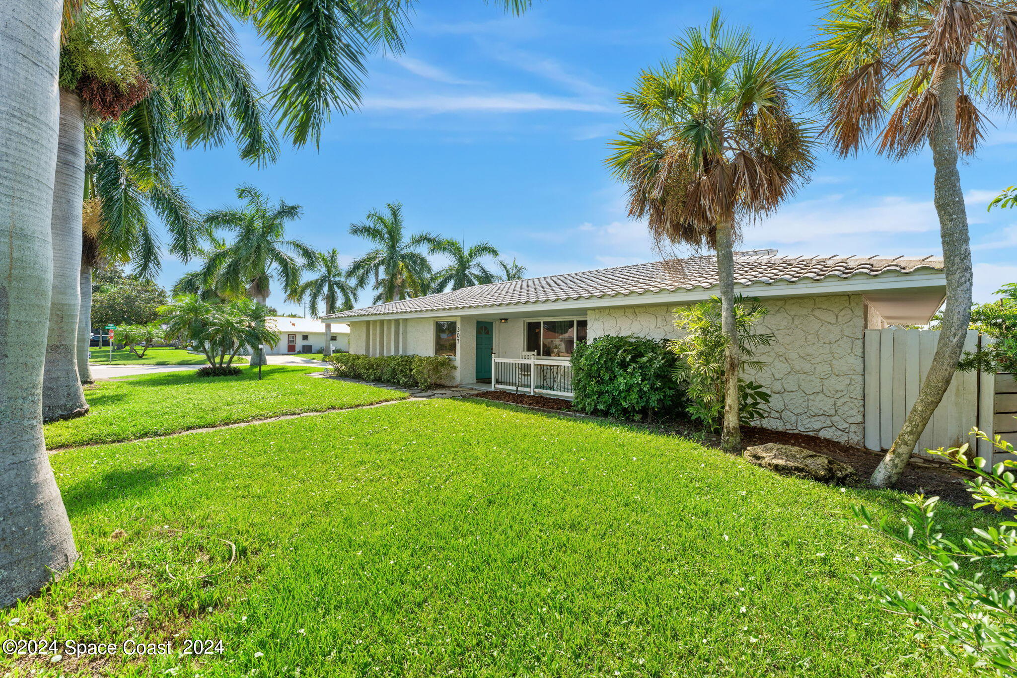 307 Brightwaters Drive Cocoa Beach, FL 32931 - Photo 2 of 45 Large corner lot front yard