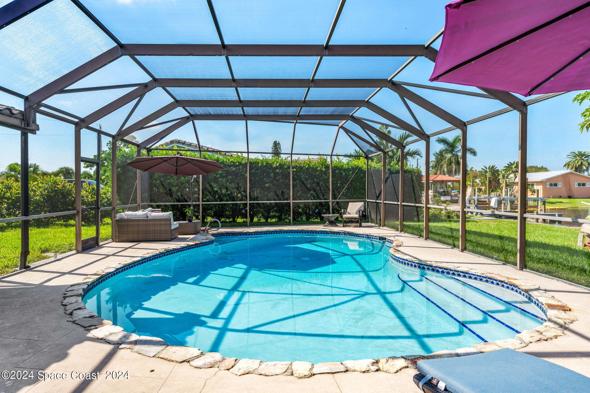 307 Brightwaters Drive Cocoa Beach, FL 32931 - Photo 30 of 45 Sparkling blue screened pool