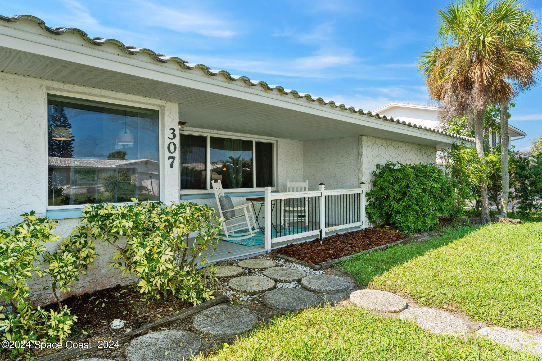 307 Brightwaters Drive Cocoa Beach, FL 32931 - Photo 4 of 45 As you approach the front porch