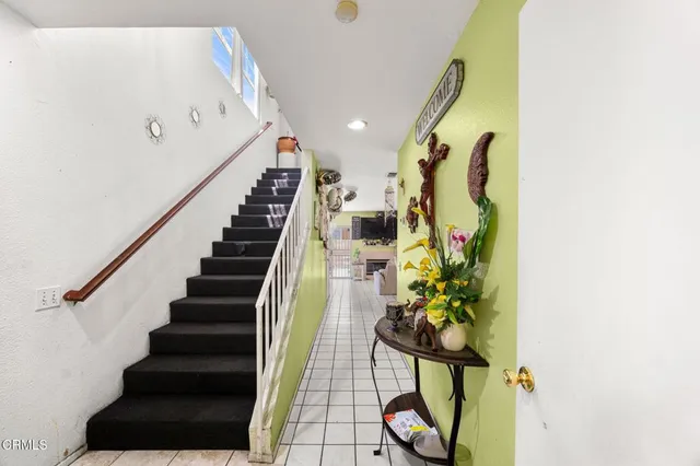 a bathroom with a sink vanity mirror and toilet