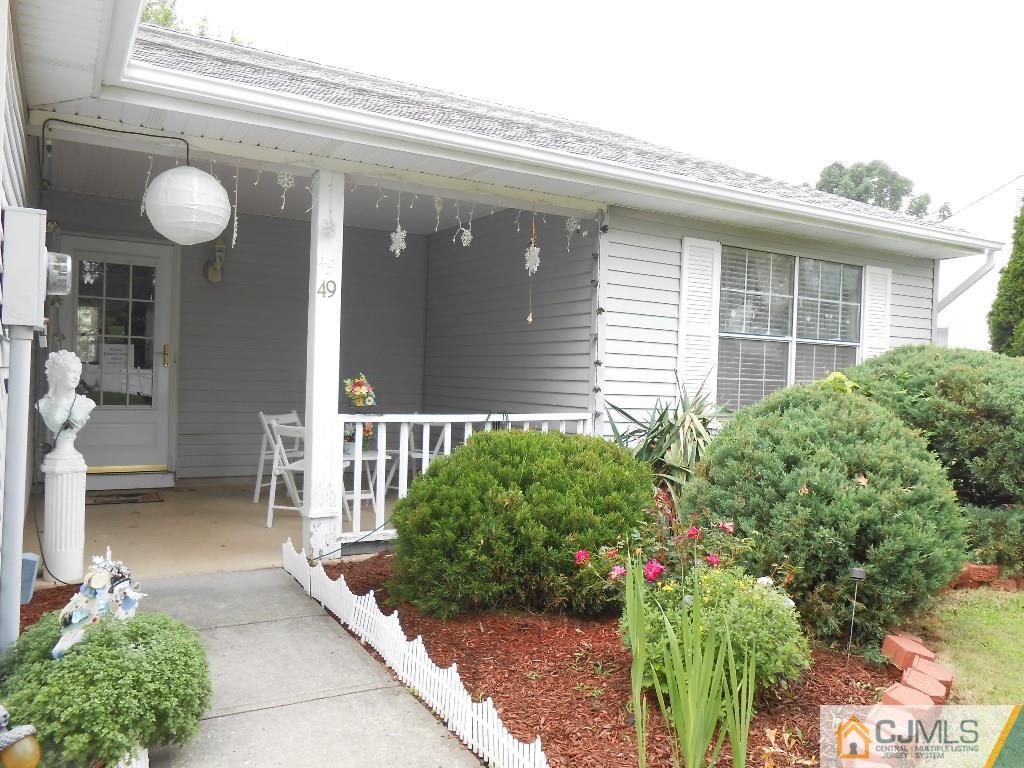 49 Rainford Road Edison, NJ 08820 - Photo 14 of 17 a front view of a house with a yard