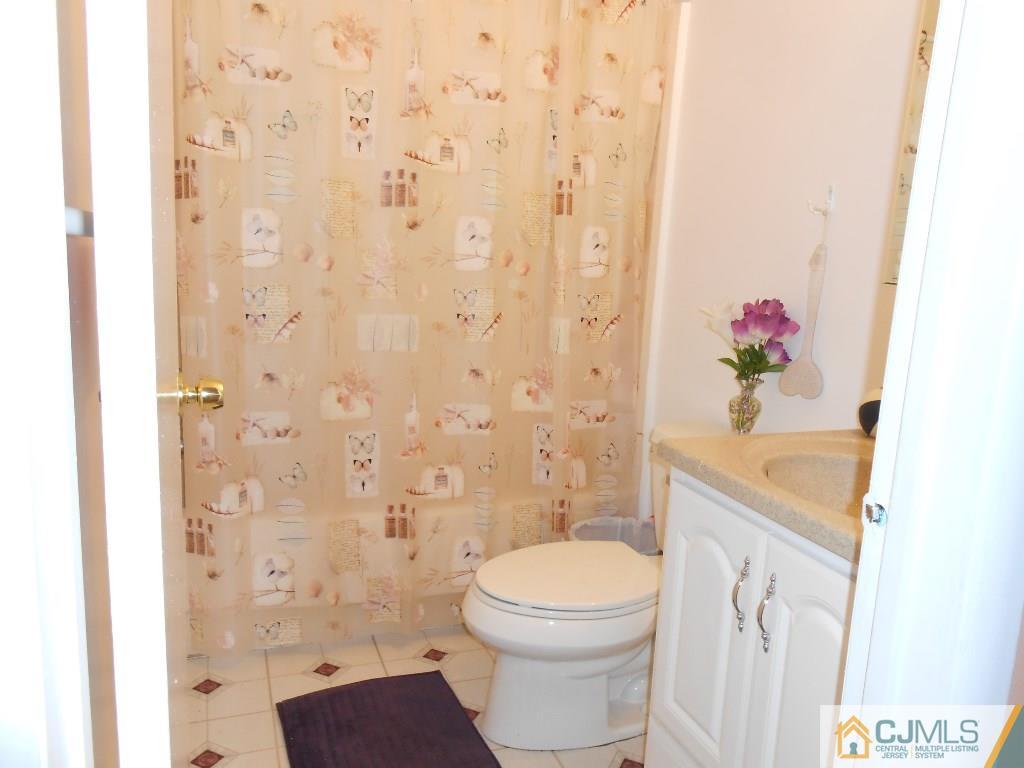 49 Rainford Road Edison, NJ 08820 - Photo 4 of 17 a white toilet sitting next to a bathroom sink