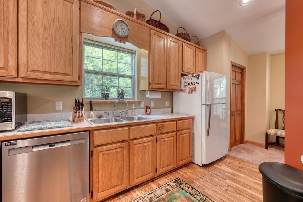 171 Mountain Top Road Blairsville, GA 30512 - Photo 20 of 54 a kitchen with stainless steel appliances granite countertop a refrigerator and a sink