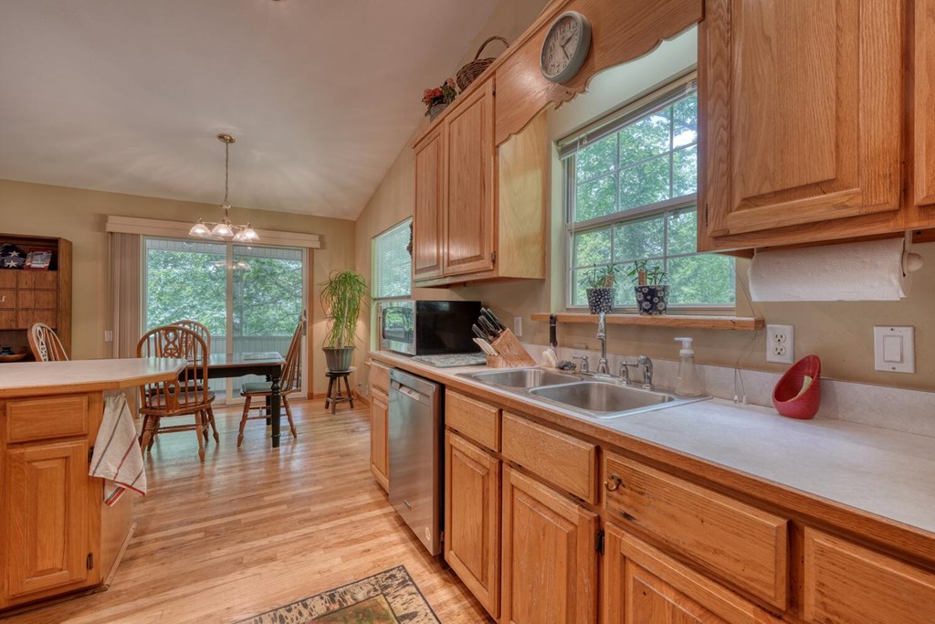 171 Mountain Top Road Blairsville, GA 30512 - Photo 22 of 54 a kitchen with a sink stove and cabinets