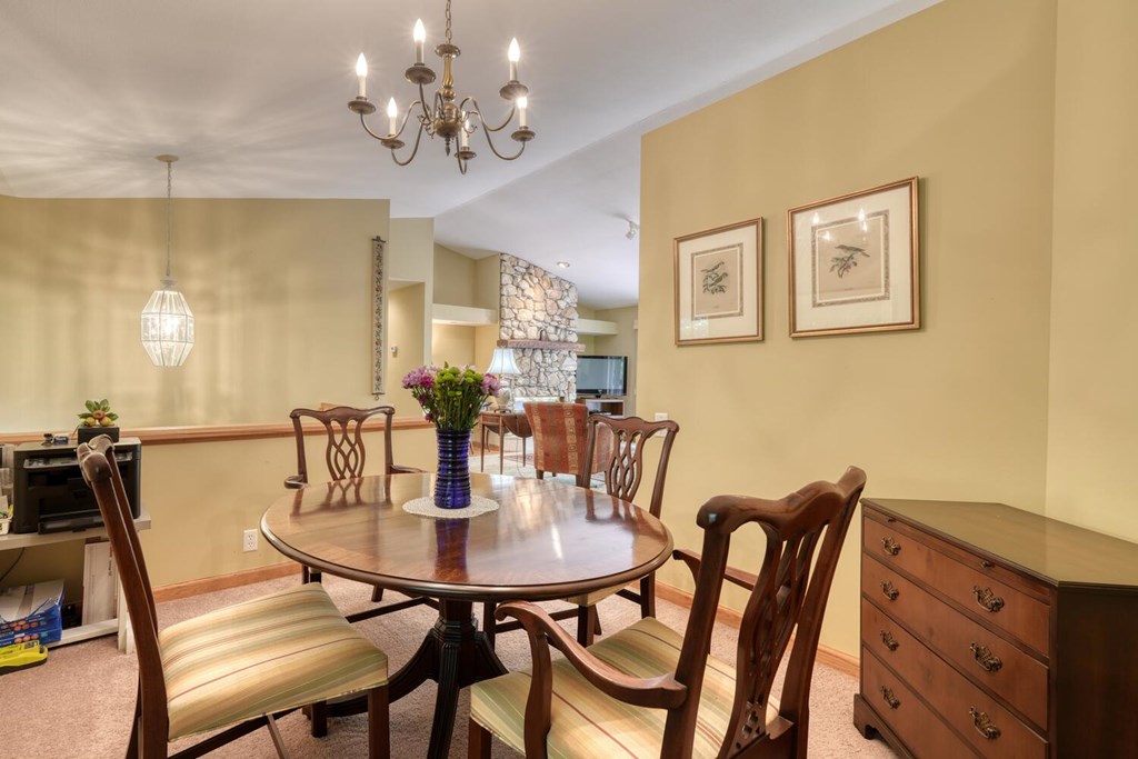 171 Mountain Top Road Blairsville, GA 30512 - Photo 24 of 54 a view of a dining room with furniture and chandelier