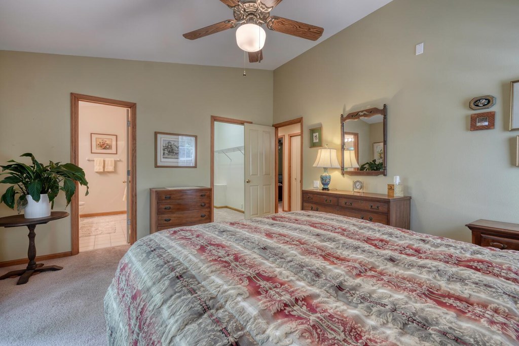 171 Mountain Top Road Blairsville, GA 30512 - Photo 28 of 54 a bedroom with a bed and a potted plant