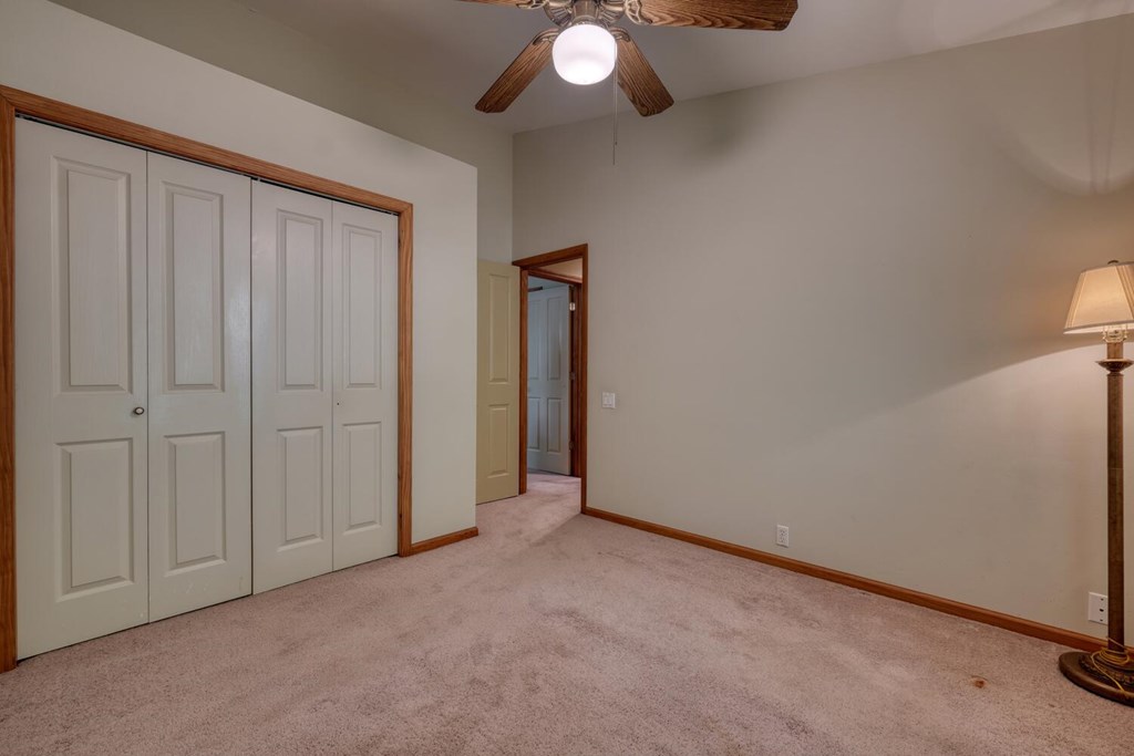171 Mountain Top Road Blairsville, GA 30512 - Photo 35 of 54 an empty room with chandelier fan