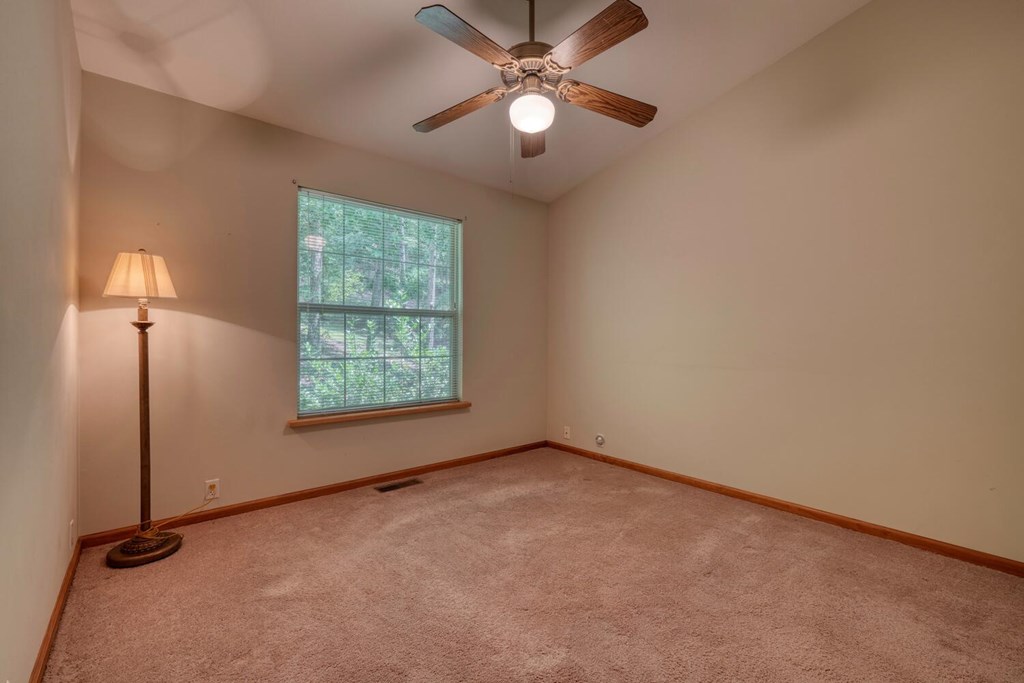171 Mountain Top Road Blairsville, GA 30512 - Photo 36 of 54 an empty room with windows and fan