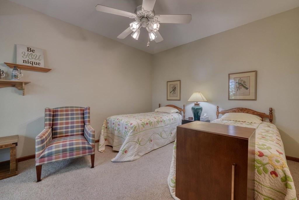171 Mountain Top Road Blairsville, GA 30512 - Photo 37 of 54 a bedroom with two beds and a chandelier