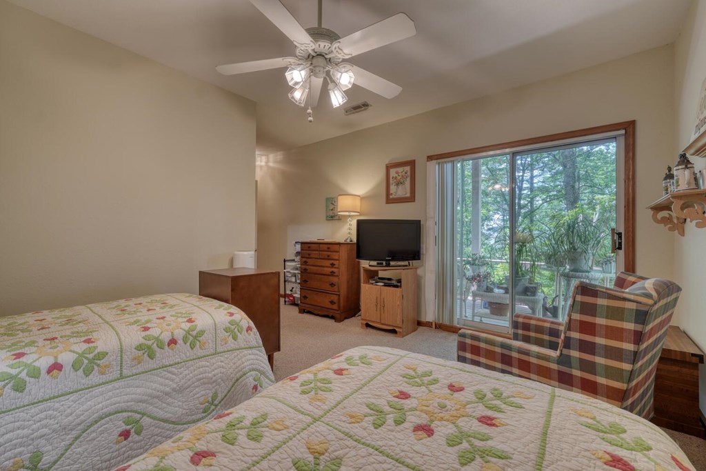 171 Mountain Top Road Blairsville, GA 30512 - Photo 38 of 54 a bedroom with a bed and a television