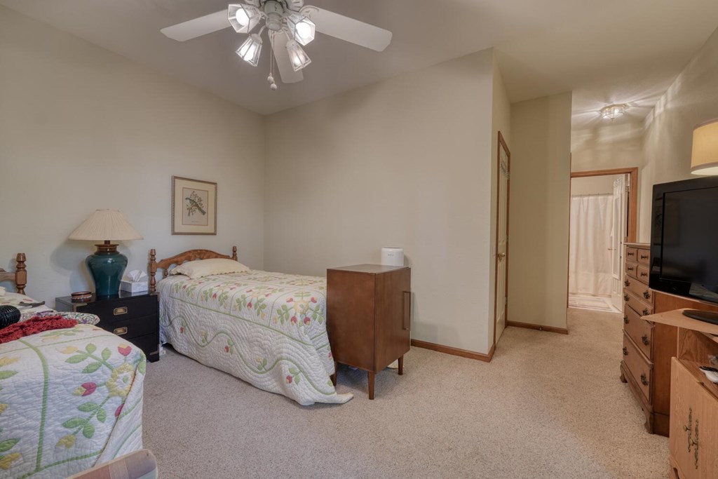 171 Mountain Top Road Blairsville, GA 30512 - Photo 39 of 54 a bedroom with a bed and a flat screen tv
