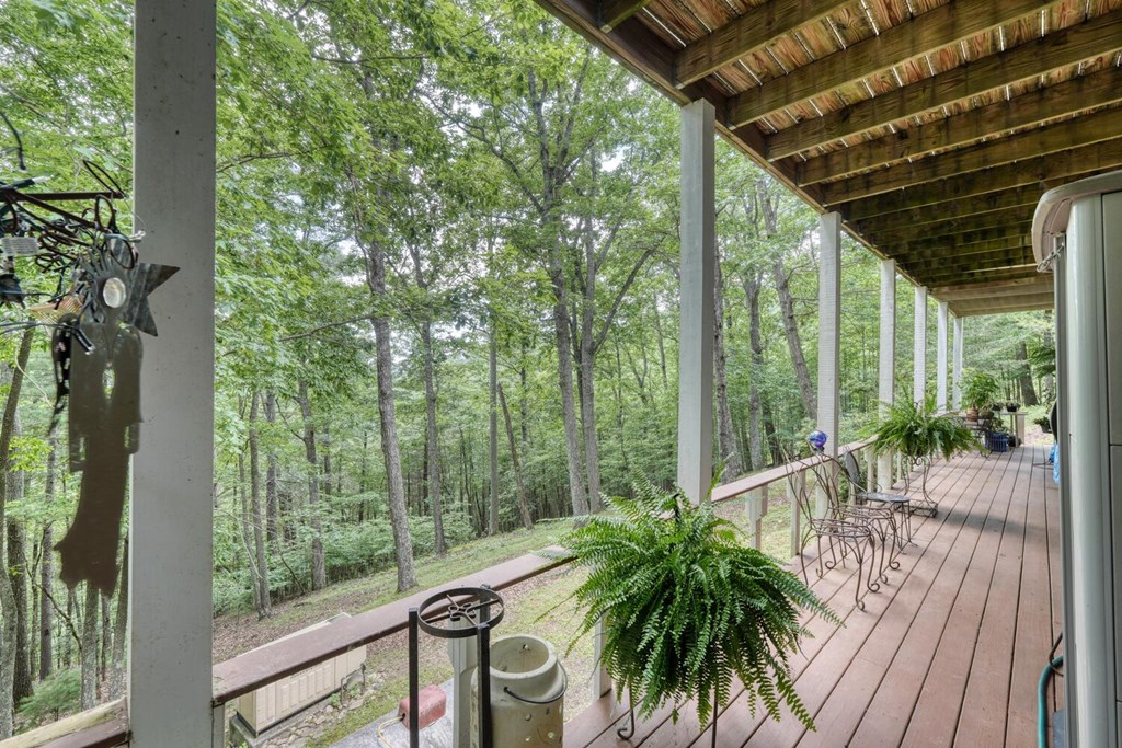 171 Mountain Top Road Blairsville, GA 30512 - Photo 47 of 54 a view of a balcony with plants and wooden fence