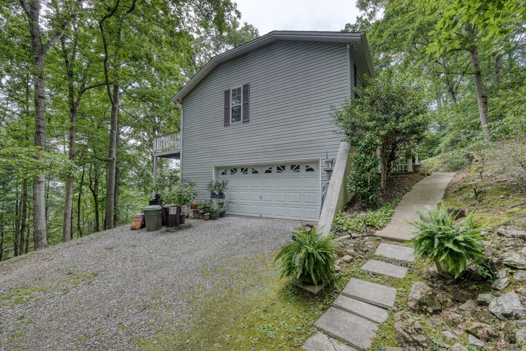 171 Mountain Top Road Blairsville, GA 30512 - Photo 10 of 54 a view of a house with a yard and potted plants