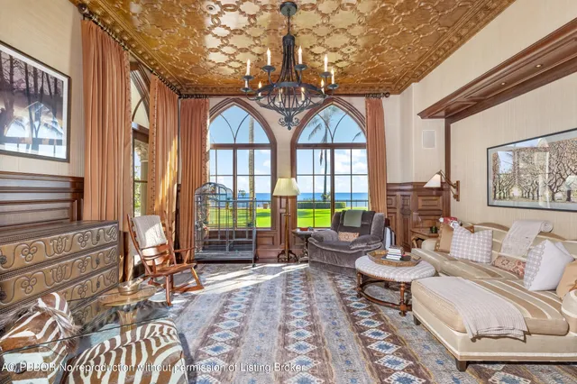 a view of a wooden door with a large tree