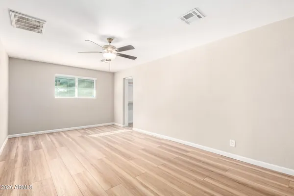 a view of an empty room with a window